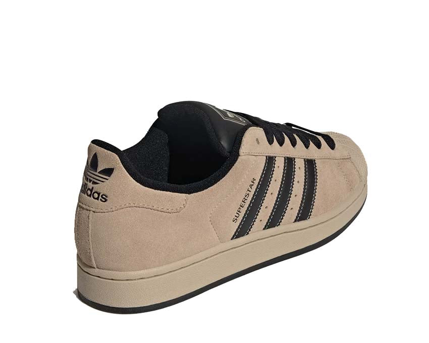 Scarpe da ginnastica in pelle color cachi pietra con design iconico a conchiglia