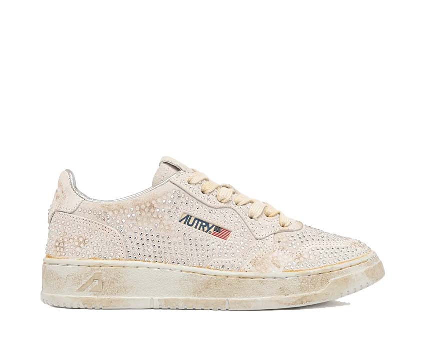 Scarpe da ginnastica basse da donna in pelle con dettagli trasparenti.