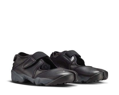 Scarpa sportiva da donna con design aperto e colore grigio scuro.