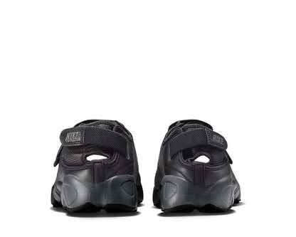 Scarpa sportiva da donna con design aperto e colore grigio scuro.