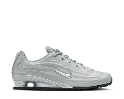 Scarpe da ginnastica con ammortizzazione a colonne, colore argento.